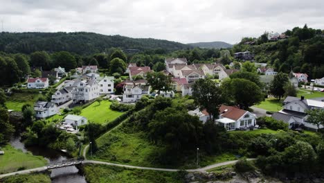 Ljungskile-village-with-traditional-houses-and-green-landscapes,-aerial-view