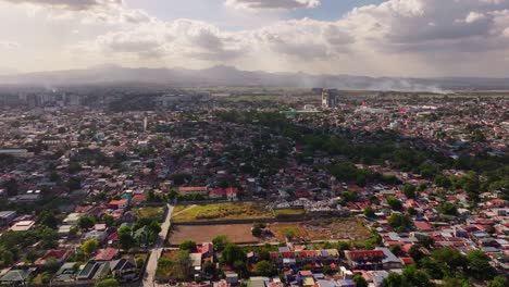 Asian-neighborhood-of-Angeles-City-with-with-agricultural-fields-in-background