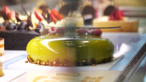 Delicious-sweet-delicatessen-cake-art-display-in-gourmet-patisserie-SLOW-SLIDE