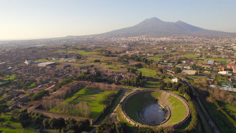 Ancient-Roman-amphitheater-and-archaeological-city-of-pompeii-at-sunset