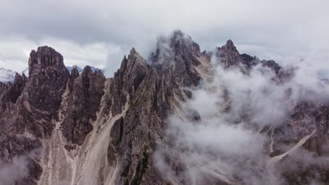 Orbit-drone-shot-of-Cadini-di-Misurina-in-Dolomites,-Italy-on-cloudy-day