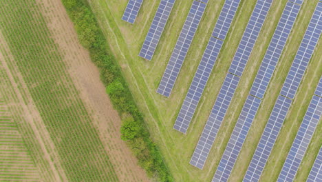 Contrasting-and-abstract-aerial-of-farmland-and-solar-technology-site-in-neighbouring-fields