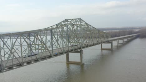 aerial-shot-of-a-trailer-crossing-over-a-bridge