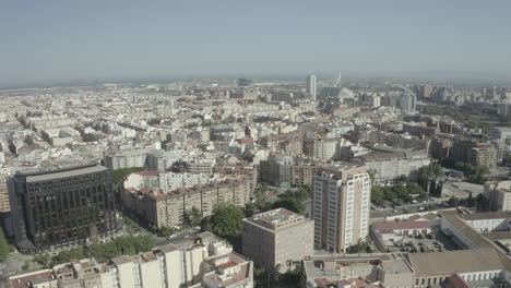 Drone-shot-of-famous-city-in-Spain,-Valencia-City-Hall-in-historic-centre-of-city---landscape-panorama-of-Europe-from-above-on-a-sunny-day-without-clouds-LOG