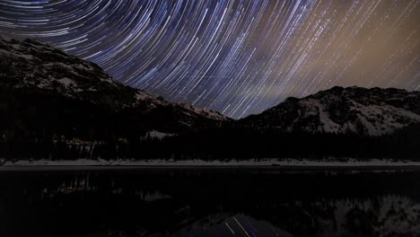 Star-Trail-At-Night-Over-Mountains-And-Lake-Palu-In-Valmalenco,-Sondrio,-Italy