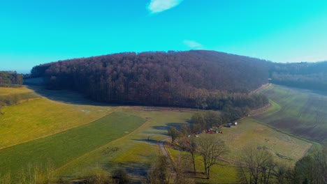 Drone-Footage-of-a-Secluded-Valley-and-Forest-in-the-Morning-Light