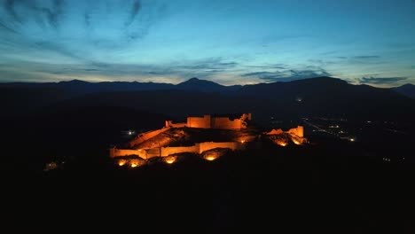 Flying-towards-an-illuminated-castle-at-dusk
