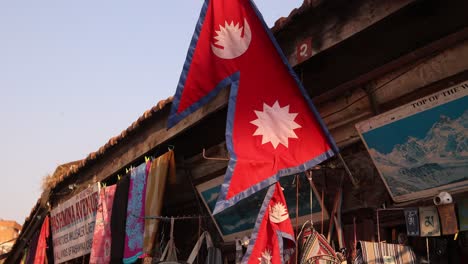 Nepali-flag-in-durbar-square-In-Kathmandu,-Nepal-at-the-base-of-the-Himalayas