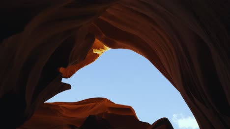 Antelope-Canyon-in-Arizona,-camera-movement-at-beautiful-and-smooth-red-sandstone-walls