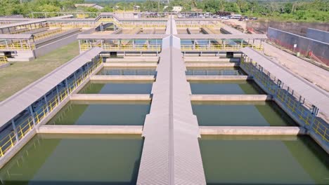 Aerial-forward-over-salt-water-basin,-industrial-plant-for-desalination