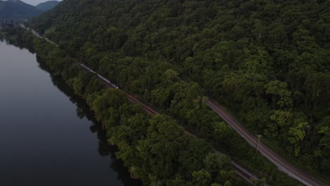 Drone-tracking-a-passenger-train-along-a-riverbank