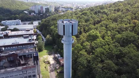 revealing-shot-city-meteorological-tower-research-center-brutalist-concrete-water-tower-in-forest