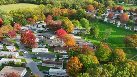 Aerial-view-of-a-suburban-area-in-autumn-with-colorful-trees
