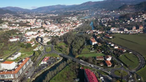 Drone-establishing-shot-of-town-of-Arcos-de-Valdevez-in-Portugal-and-river-Vez-flowing