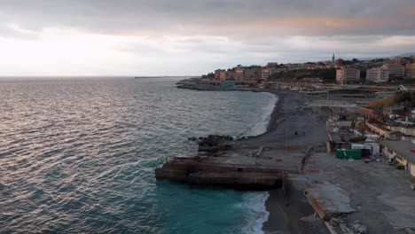 Nervi-in-genoa,-italy,-showcasing-the-coastline,-architecture,-and-tranquil-sea-at-dusk,-aerial-view