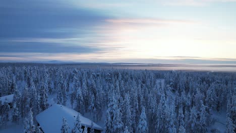 Drone-Dusk-Shot-Of-Winter-Wonderland-In-Lapland,-Finland,-Arctic-Circle