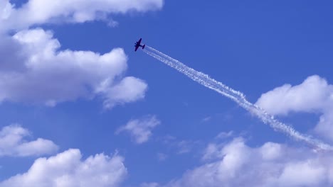 Airshow--Airplane-doing-spiral-with-smoke-trails