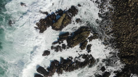 4K-overhead-drone-shot-of-enormous-wave-smashing-rocks-on-the-California-Coast