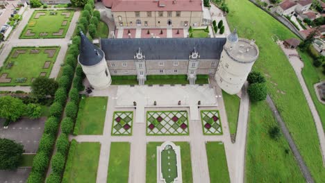 drone-shot-tilting-down-of-the-Chateau-de-Boutheon-in-Andrezieux-Boutheon,-Loire-departement,-France