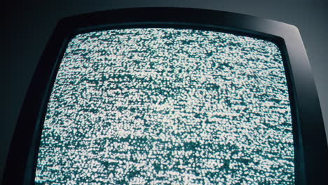 Retro-television-with-static,-blinking-screen,-dark-backdrop