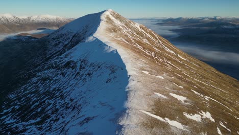 snowy-mountain-ridge-in-highlands-scotland-sgurr-an-fhuarain-glen-kingie-aerial