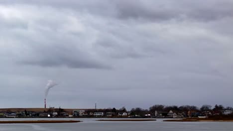 An-aerial-time-lapse-of-a-marsh-on-a-cloudy-day-with-gray-skies