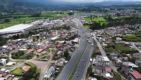 Aerial-view-of-the-Tambillo-parish:-Panamericana-Sur-E35-in-the-Mejía-canton,-province-of-Pichincha