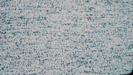 A-close-up-static-shot-capturing-the-iconic-snow-like-pattern-of-TV-static-noise