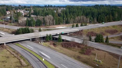 Circling-drone-time-lapse-of-the-I-5,-405,-and-525-interchange-in-Lynnwood,-Washington