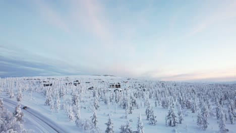 Drone-Flies-Towards-Small-Village-In-Arctic-Lapland-Finland