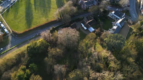 Residential-area-in-bury-st-edmunds-with-houses-and-greenery,-shot-during-daylight,-aerial-view