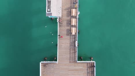 Aerial-View-of-southern-california-pier-with-a-beautful-orange-sunset