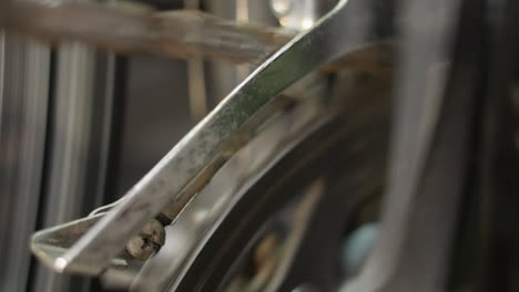 Closeup:-Bicycle-chainwheel-turns-slowly-during-drivetrain-maintenance