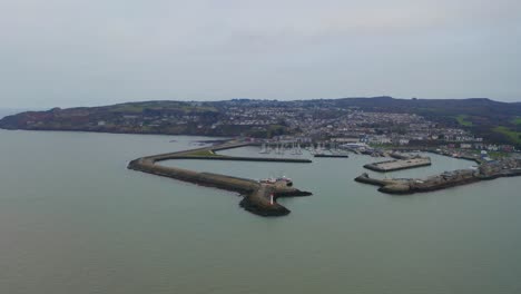Aerial-trucking-shot-of-Howth-Harbour-and-town
