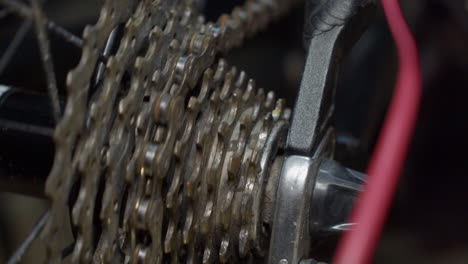 Close-up-of-bicycle-rear-sprocket-as-bike-chain-slowly-spins-wheel