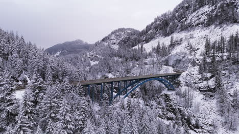Paulson-Bridge-and-Crowsnest-Highway-in-a-Mountainous-Landscape-in-Winter