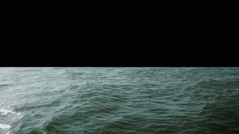 Slightly-green-Ocean-horizon-center-of-screen-with-black-background