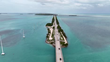 Florida-Keys-Road-With-Cars-Drone-Shot-above-crystal-clear-waters-close-to-Miami