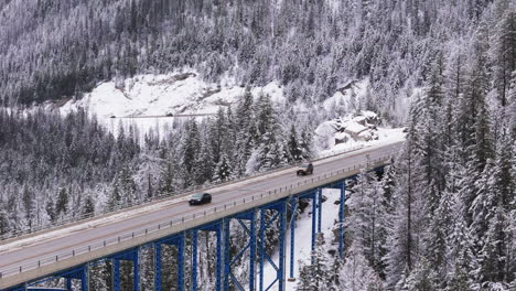 Aerial-Dance:-Cars-Trace-Paulson-Bridge-Across-Winter-Wonderland