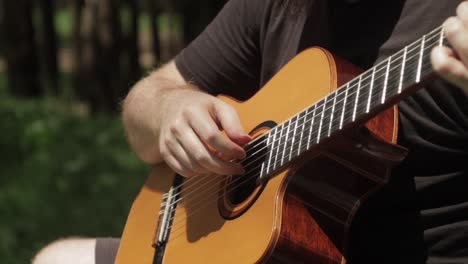 Guitar-Close-Up-Man-Playing-Fingerstyle-Finger-Picking-Acoustic-Classical-Guitar