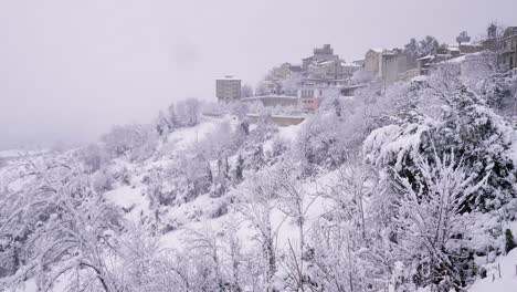 View-of-snow-covered-Guardiagrele-from-the-Garden-of-Villa-Comunale,-Abruzzo,-Italy