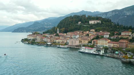 AERIAL:-Nestled-at-the-tip-of-a-promontory-jutting-into-Lake-Como,-Bellagio-boasts-unparalleled-shoreline-and-Alpine-views