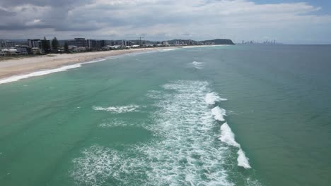 Waves-Gently-Breaking-On-Palm-Beach---Gold-Coast---Queensland-QLD---Australia---Drone-Shot