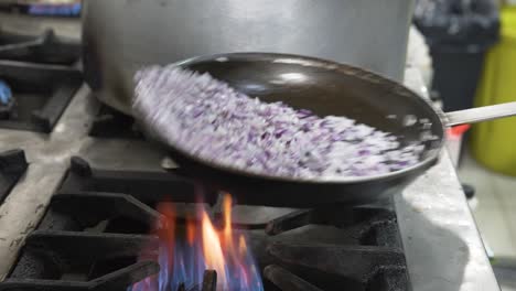 Flaming-Red-Onions-Frying-in-Skillet