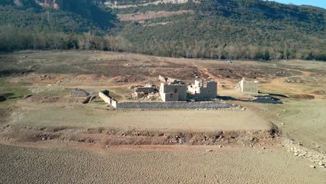 Sau-swamp-dike-in-Catalonia,-Spain,-intense-drought-in-2024-Views-of-a-village-that-is-normally-submerged