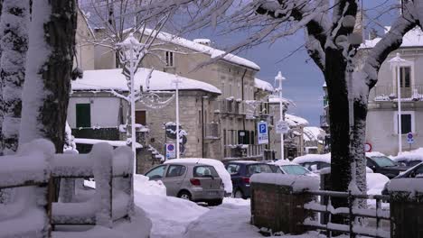 Houses-and-cars-under-snow-in-Guardiagrele,-Abruzzo,-Italy