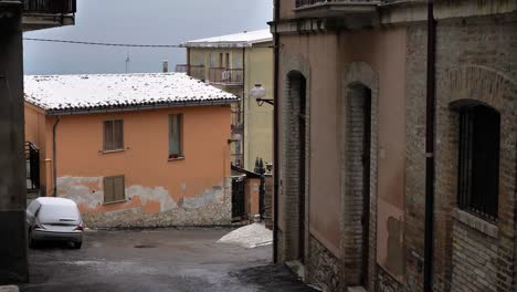 View-of-a-small-house-with-snow-on-the-roof-in-Guardiagrele,-Abruzzo,-Italy