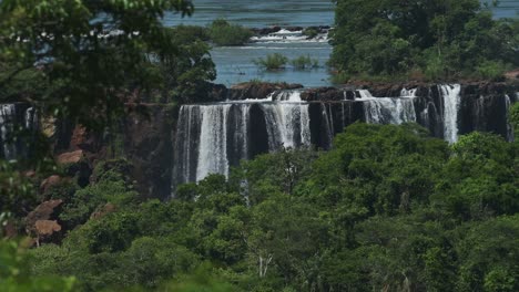 Amazing-Picturesque-Rainforest-Landscape-Hiding-Colourful-Waterfalls-in-Jungle,-Beautiful-Trees-and-Green-Scenery-with-Large-Group-of-Huge-Waterfalls-Hidden-in-Iguazu,-Brazil