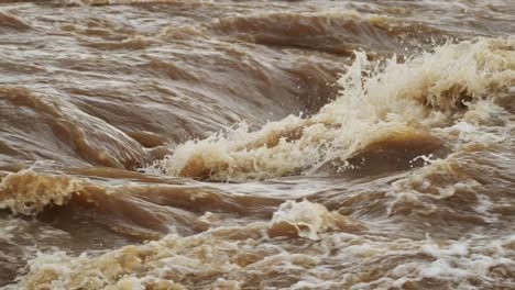 Slow-Motion-Shot-of-Powerful-crashing-water-in-Mara-river,-waves-and-turbulent-stream,-African-nature-in-Maasai-Mara-National-Reserve,-Kenya,-Africa-Safari-trips-in-Masai-Mara-North-Conservancy