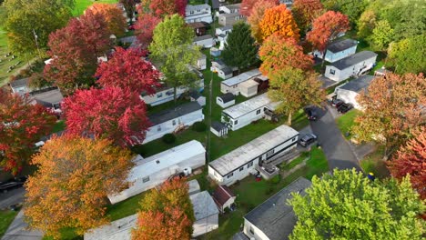 Mobile-homes-in-trailer-park-with-colorful-trees-in-autumn